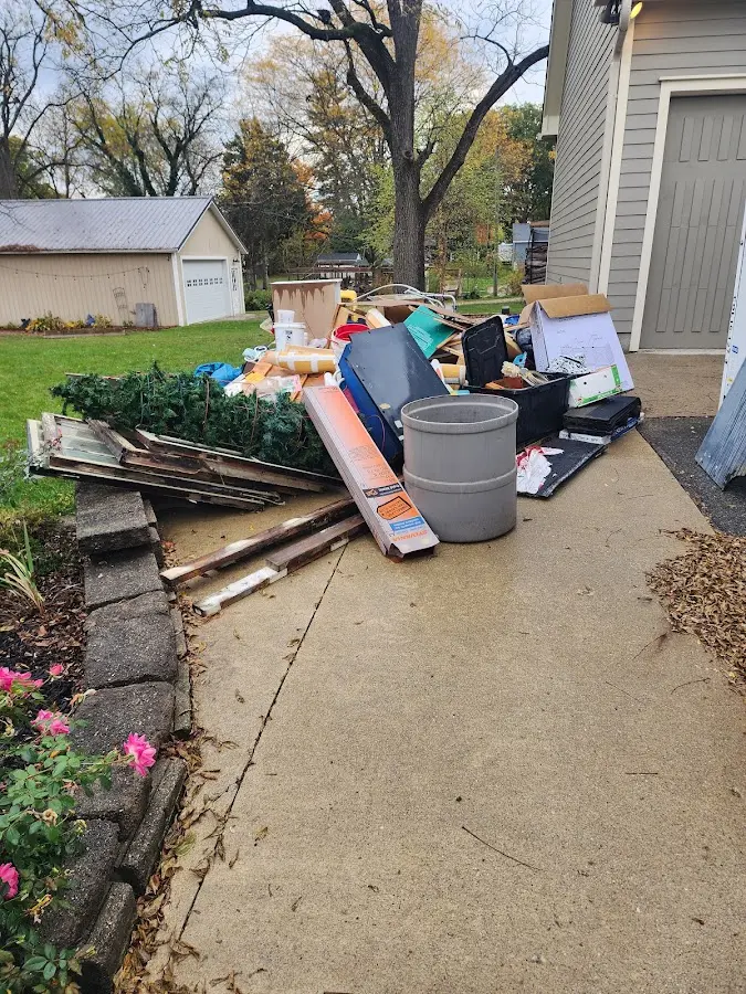 Dumpster being loaded with debris for Commercial Dumpster Rental in Slippery Rock